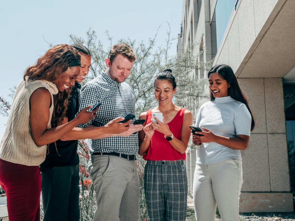 Diverse group of people smiling while preparing to contact Fearless Homebuyers clients
