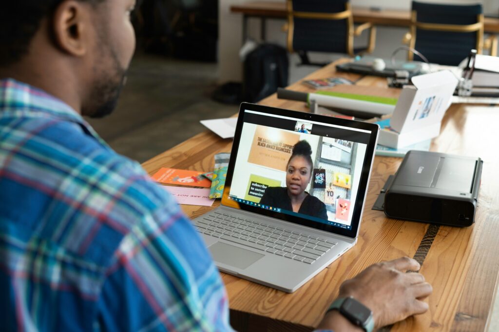 Person on a video call representing a one-on-one consultation and offering first time homebuyer tips.